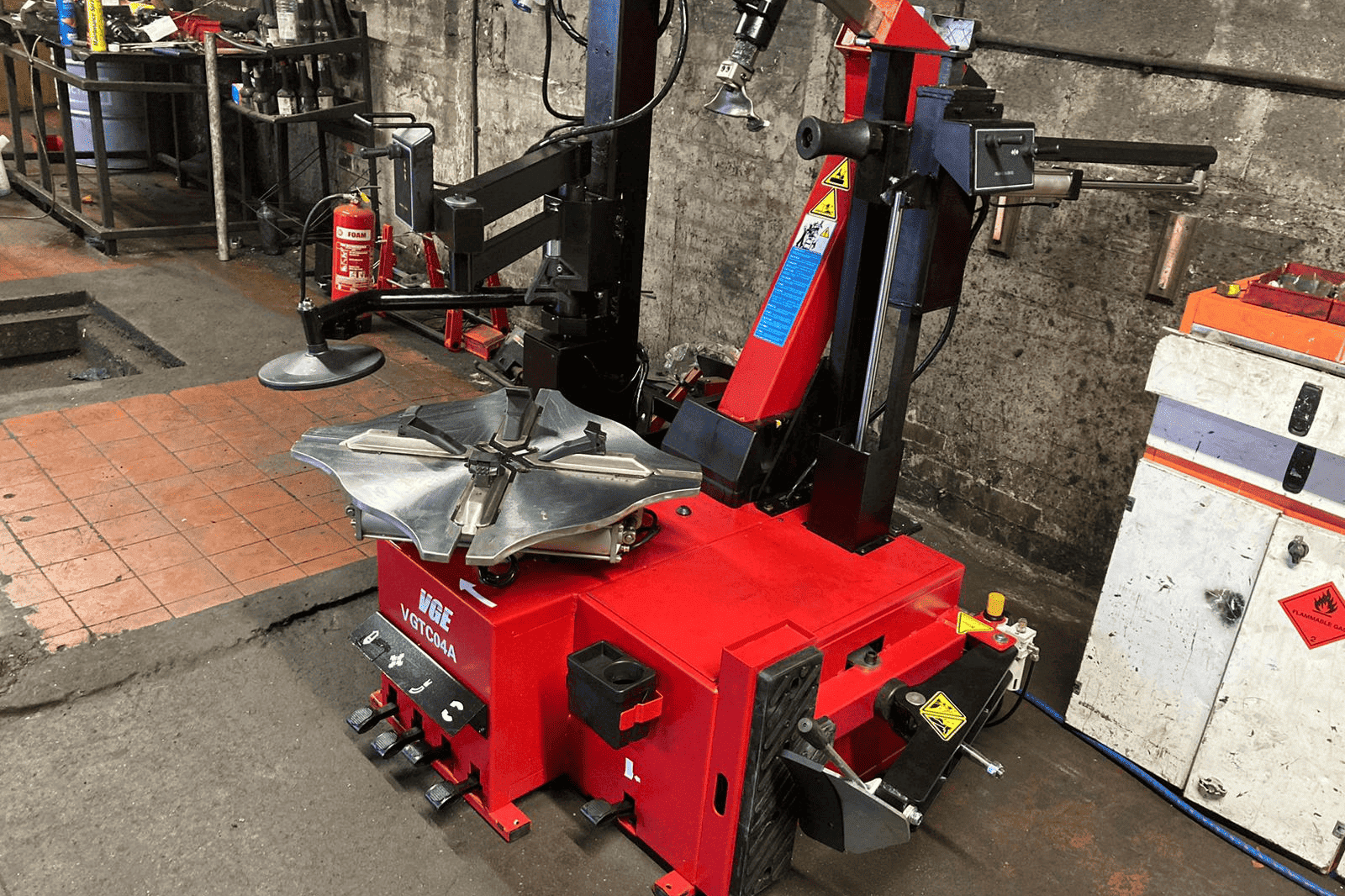 A Tyre Changing and Alignment machine in a warehouse